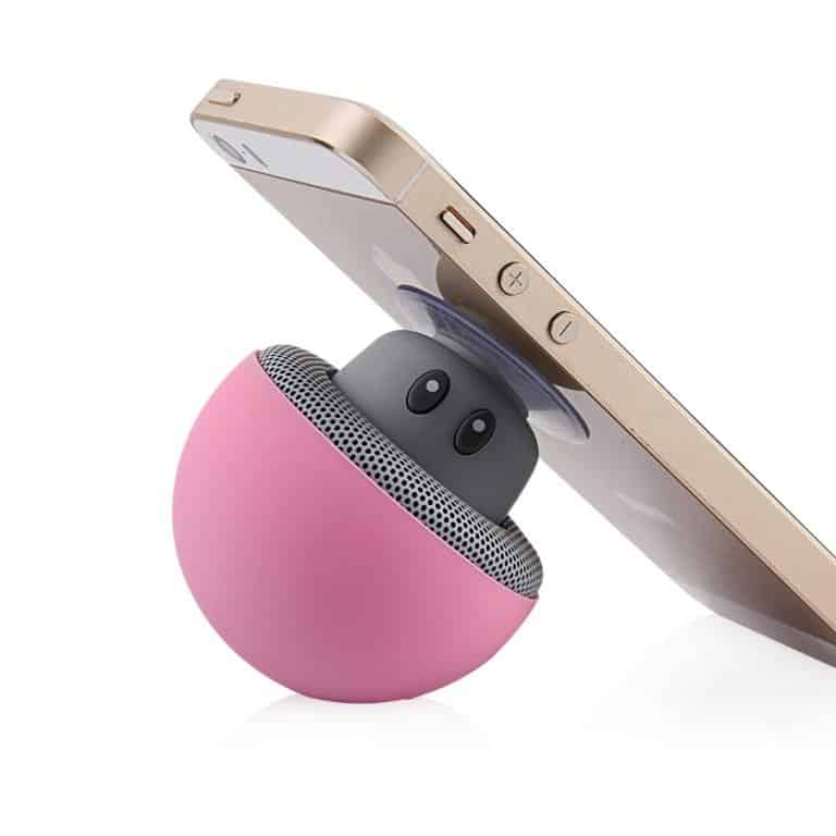 A cute portable speaker attached to a smartphone 