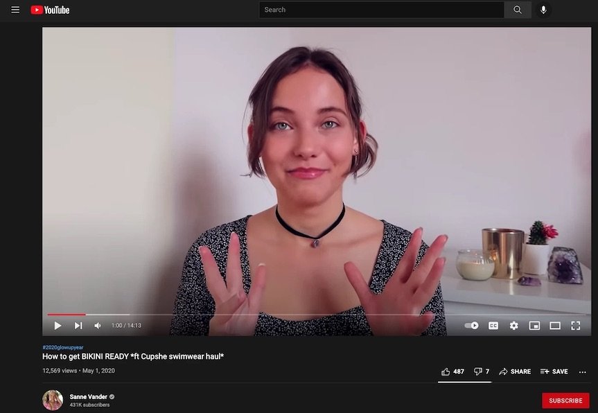 a picture showing the YouTube channel of a blogger promoting her merch through social media