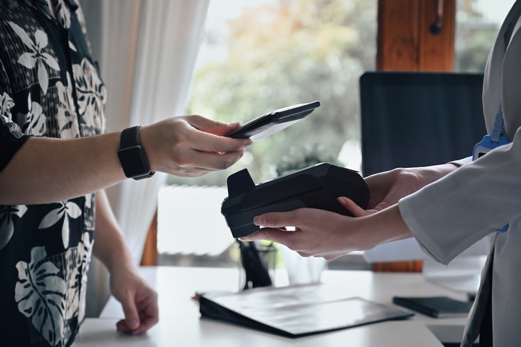 Photo of a customer buying a product