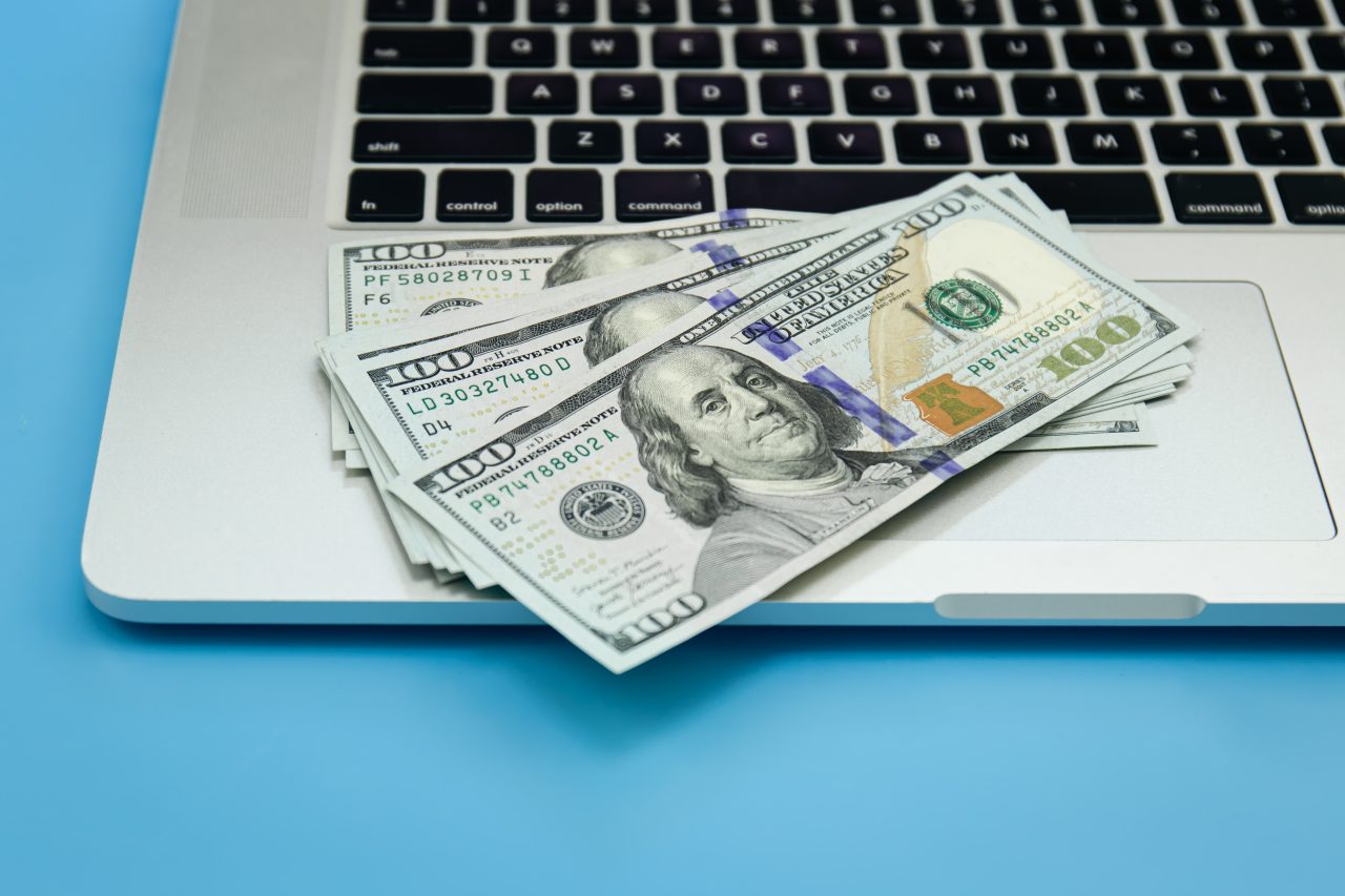 photo of money on a laptop
