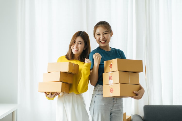 photo of women with packages